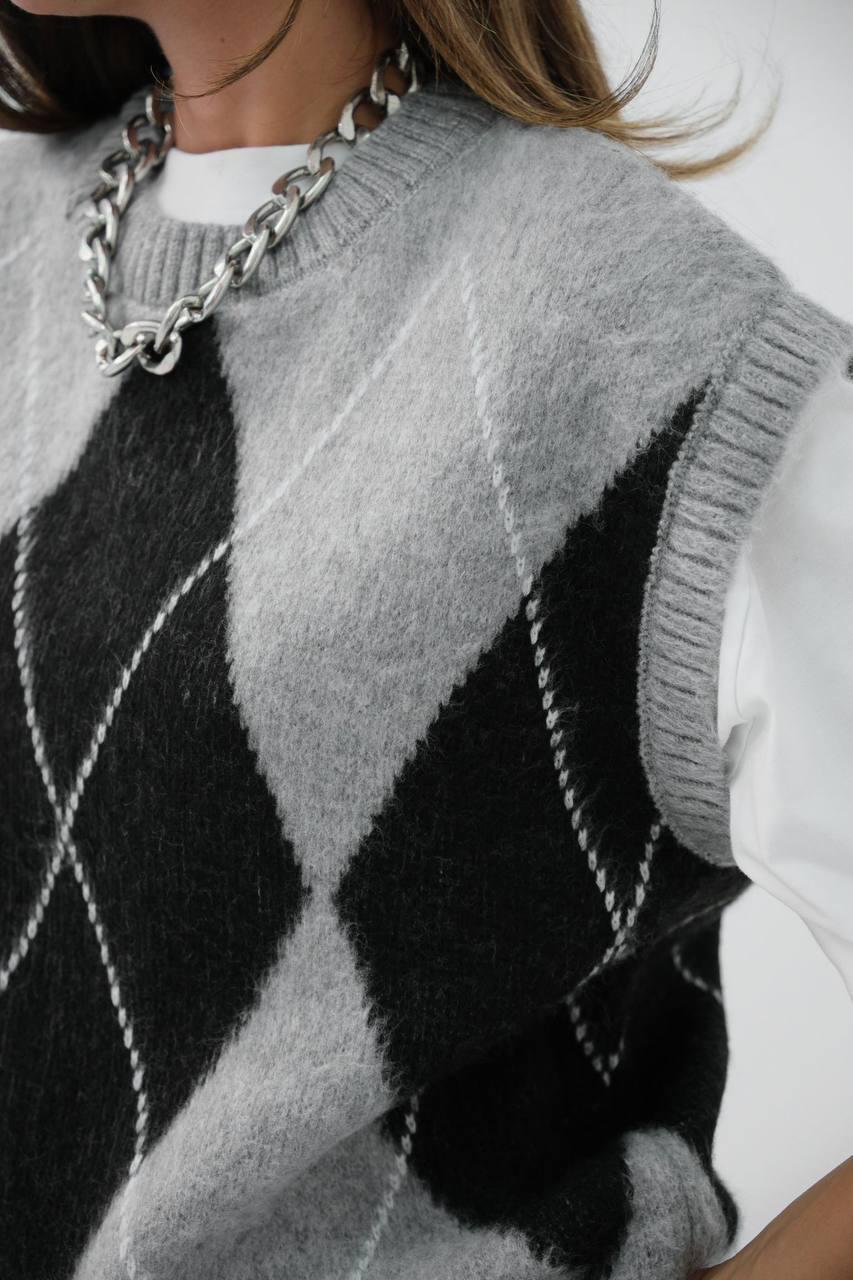 Pull à carreaux sans manches